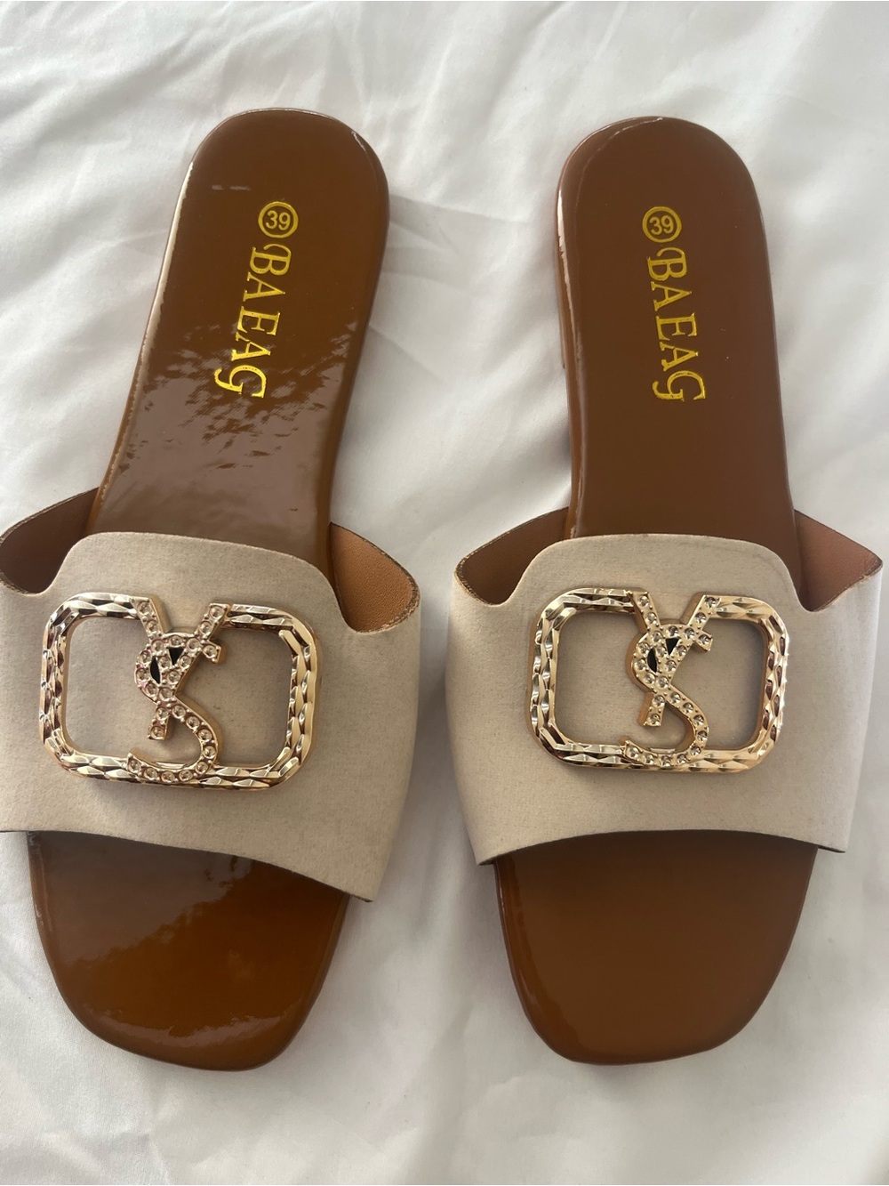 Beige Slide Mules with Gold Chain Emblem